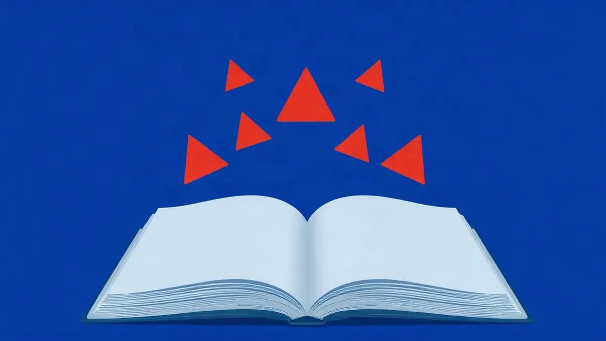كتاب مفتوح بصفحات خالية ترتفع فوقه ثلاثة مثلّثات تحذير حمراء